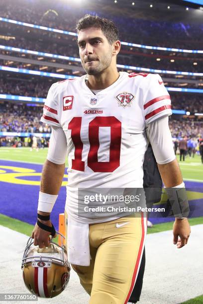 Jimmy Garoppolo of the San Francisco 49ers walks off the field after being defeated by the Los Angeles Rams in the NFC Championship Game at SoFi...