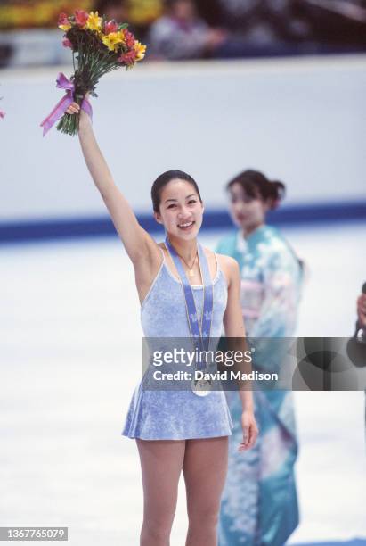Michelle Kwan of the USA takes part in the medal ceremony of the Ladies Singles event of the figure skating competition in the 1998 Winter Olympics...