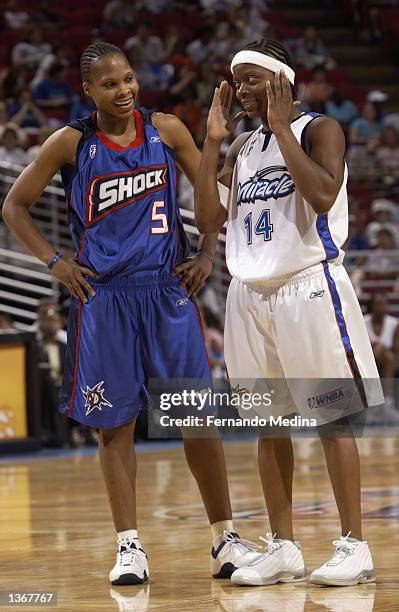 Elaine Powell of the Detroit Shock and Shannon Johnson of the Orlando Miracle talk during the game on August 11, 2002 at TD Waterhouse Centre in...