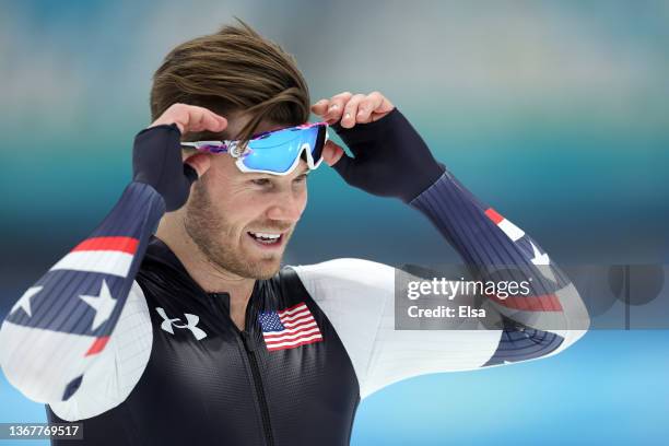 Joey Mantia of Team United States adjusts his glasses during a speed skating practice session ahead of the Beijing 2022 Winter Olympic Games at...