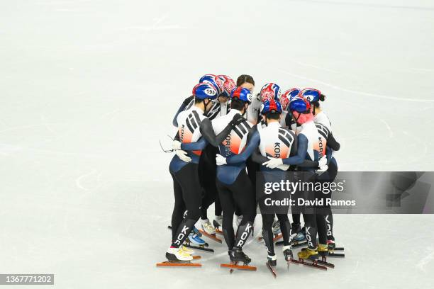 Team South Korea athletes huddle during a Short Track Speed Skating official training session ahead of the Winter Olympics at the Capital Indoor...