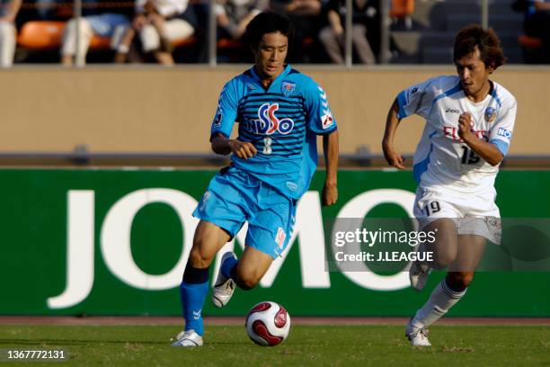 Oh Beom-Seok of Yokohama FC takes on Yusuke Mori of Kawasaki Frontale during the J.League J1 match between Yokohama FC and Kawasaki Frontale at...