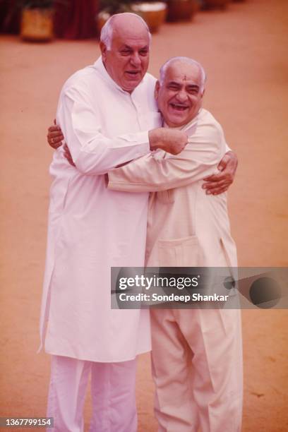 Jammu and Kashmir Chief Minister Farooq Abdullah with BJP leader Madan Lal Khurana after BJP-NDA government is sworn-in on on March 19, 1998 in...