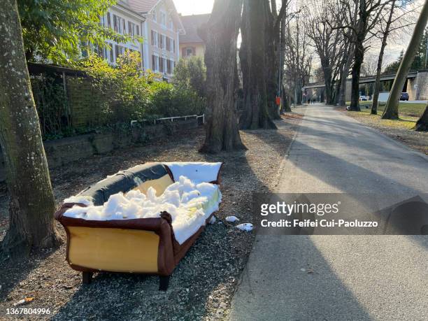 a broken couch at street of biel - broken tree stock pictures, royalty-free photos & images