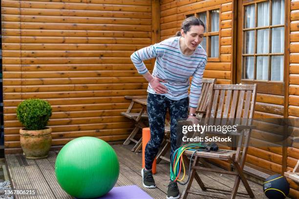 exhausted from exercise - agony in the garden stockfoto's en -beelden