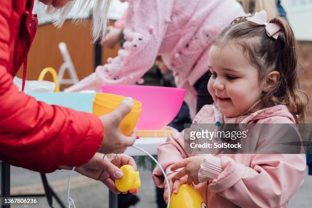 visiting an easter yard sale - kid making money stock pictures, royalty-free photos & images