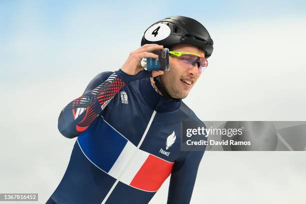 Sebastin Lepape of Team France speaks on his mobile phone during a Short Track Speed Skating official training session ahead of the Winter Olympics...