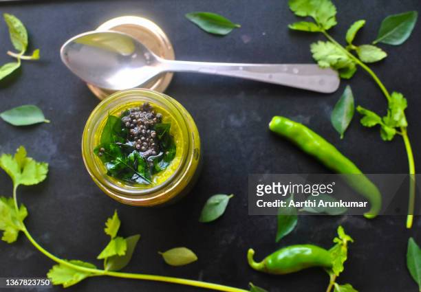 tempered green chutney in a jar - チャツネ ストックフォトと画像