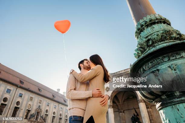 a happy couple in love is having a fun time in the city - zeitstrahl stock-fotos und bilder