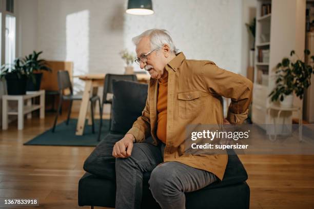 senior men having back pain - kidney stone stock pictures, royalty-free photos & images