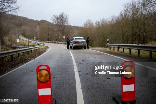 Police officers block a road leading to the scene of a shooting that left two police officers dead in Ulmet on January 31, 2022 near Kusel, Germany....