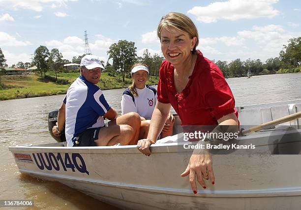 Queensland Premier Anna Bligh poses for a photo on a boat on the Brisbane River after visiting members of the Centenary Rowing Club which was hard...