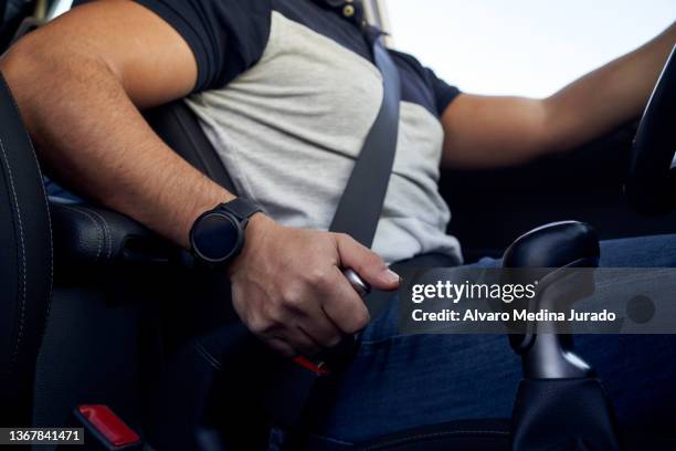 close-up of an unrecognizable young hispanic man using the handbrake inside his car. - notbremse stock-fotos und bilder