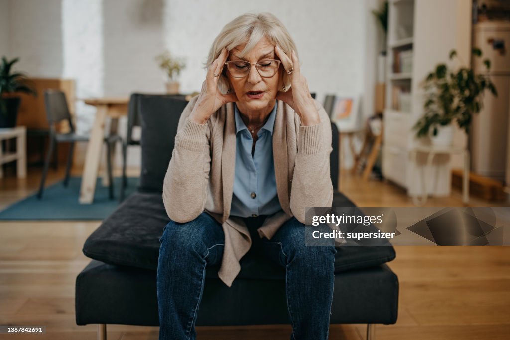 Older woman having headache