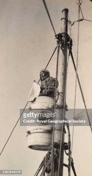 Commander Frank Wild in the crow’s nest, Shackleton-Rowett Antarctic Expedition 1921-1922 'Quest'.