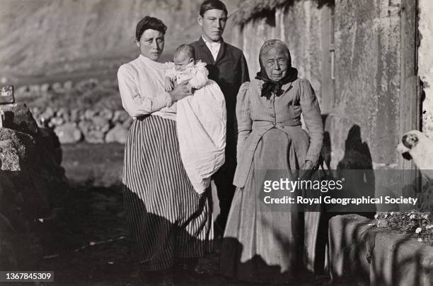 Betty Cotton aged 95 years, Tristan da Cunha. Shackleton-Rowett Antarctic Expedition 1921-1922 'Quest'. She is standing with a young couple and their...