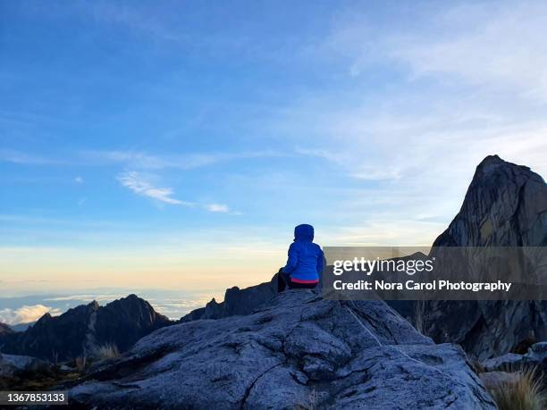 women at mt. kinabalu looking over low's gully during sunrise - east malaysia stock pictures, royalty-free photos & images