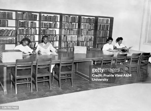 Students reading in the East Side of the Room of W.R. Banks Library at Prairie View, Texas,