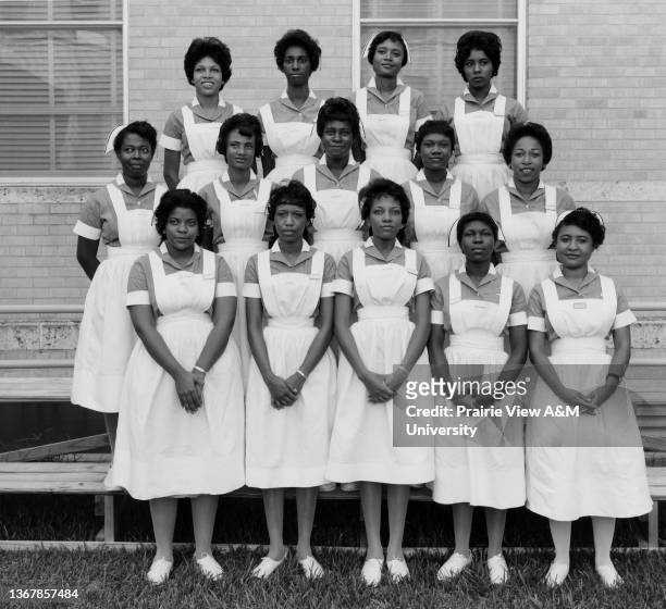 Group of 14 nursing students posing outside the Veteran's Administration Hospital in Houston, TX, 1960s.