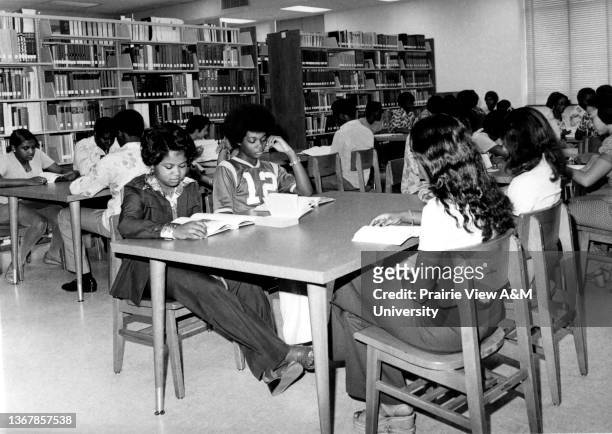 Students working and studying in the W.R. Banks Library at Prairie View A&M University.