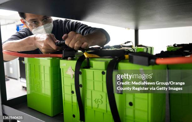 Signal Hill, CA Steven Chung, co-founder of ReJoule, sets up used electric vehicle batteries to be tested at the company"u2019s offices in Signal...