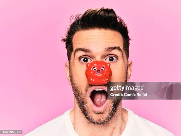 . Joel Dommett poses wearing a Red Nose Day 2022 Red animal nose, whilst in the studio in London on the 24th November.