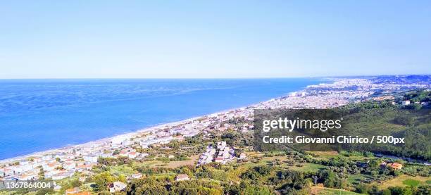 panoramic,high angle view of sea against clear blue sky,silvi marina,silvi,teramo,italy - abruzzi stock-fotos und bilder