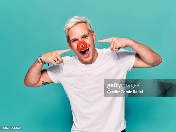 21st October: . Actor, Investor and Television personality Jamie Laing modelling the latest merchandise for Red Nose Day 2022. Taken in the studio in...