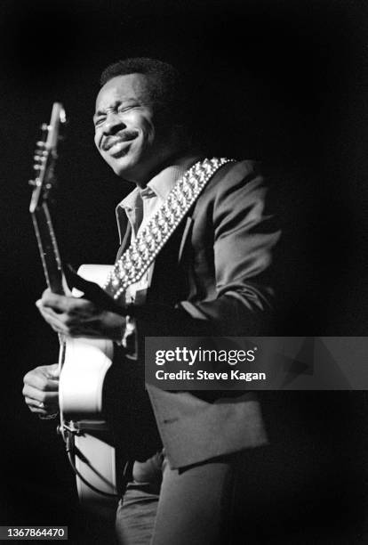 American Jazz musician George Benson plays guitar as he performs onstage at the University of Michigan, Ann Arbor, Michigan, October 13, 1976.