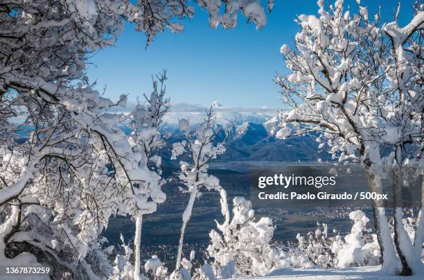 scenic view of snow covered landscape against sky,caselette,turin,italy - alba bildbanksfoton och bilder