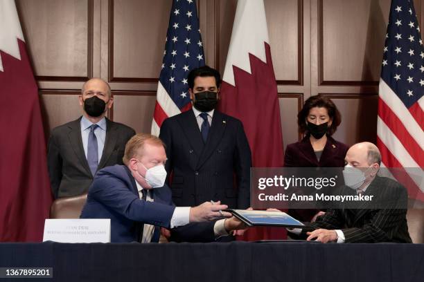Boeing Commercial Airplanes CEO Stan Deal and Qatar Airlines CEO Akbar Al Baker sign documents in the Eisenhower Executive Office building on January...