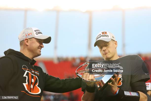 Quarterback Joe Burrow and Head Coach Zac Taylor of the Cincinnati Bengals pose with the Lamar Hunt Trophy after the Bengals defeated the Kansas City...