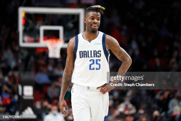 Reggie Bullock of the Dallas Mavericks looks on against the Portland Trail Blazers during the first half at Moda Center on January 26, 2022 in...