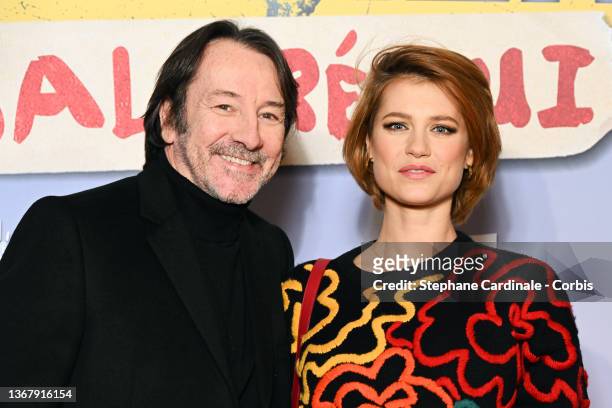 Jean-Hugues Anglade and Alice Dufour attend the "Super Heros Malgre Lui" Premiere At Le Grand Rex on January 31, 2022 in Paris, France.