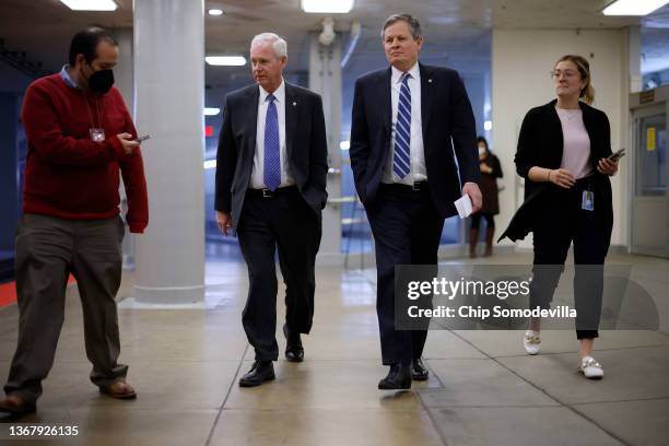 Sens. Ron Johnson and Steve Daines arrive at the Capitol for a vote on January 31, 2022 in Washington, DC. Congress is returning from a week-long...