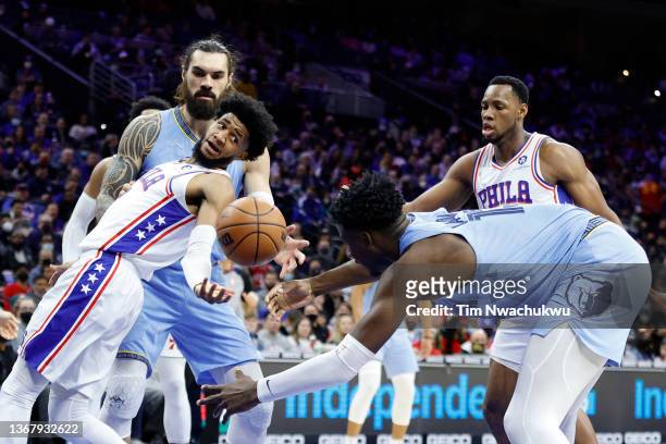 Isaiah Joe of the Philadelphia 76ers and Jaren Jackson Jr. #13 of the Memphis Grizzlies reach for a rebound during the second quarter at Wells Fargo...