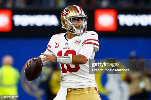 Jimmy Garoppolo of the San Francisco 49ers looks to pass the ball in the NFC Championship Game against the Los Angeles Rams at SoFi Stadium on...