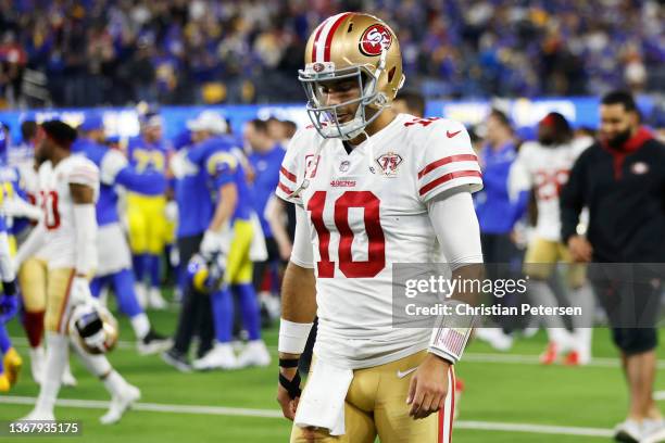 Jimmy Garoppolo of the San Francisco 49ers walks off the field after being defeated by the Los Angeles Rams in the NFC Championship Game at SoFi...