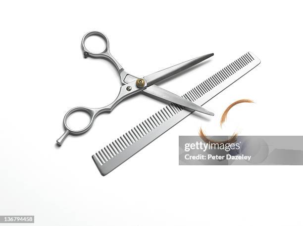 hairdresser scissors and comb on white background - forbici foto e immagini stock