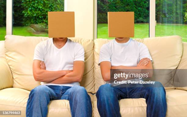 adolescents with card box on head - boxhead stock pictures, royalty-free photos & images