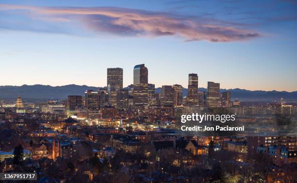 denver skyline and the rocky mountains at sunset - denver winter stock pictures, royalty-free photos & images