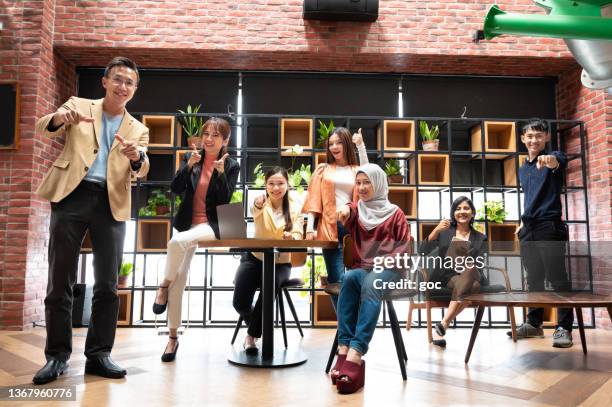 portrait of multiracial business professionals in co-working office - malay hijab stock pictures, royalty-free photos & images