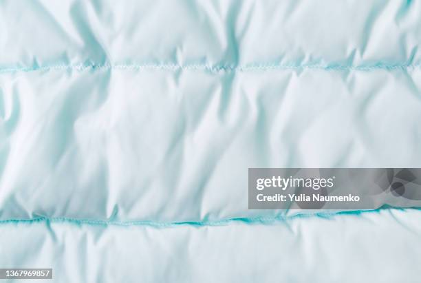 fabric background. fabric for a warm jacket, waterproof fabric. - bedding stock pictures, royalty-free photos & images