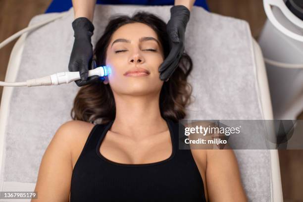 beauty treatment at professional dermatology clinic - beauty laser bildbanksfoton och bilder