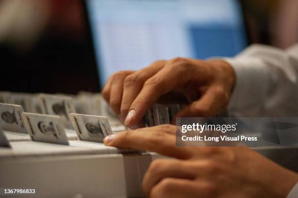 Colombian migration officer searches for a Temporary Residence Permit for a Venezuelan migrant on January 27, 2022. Colombia Migration is organizing...