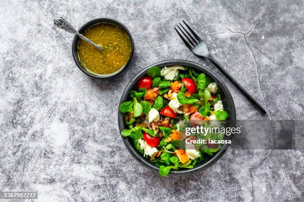 lambs lettuce with blood orange, tomatoes, mozzarella, pumpkin seeds - condiment stock pictures, royalty-free photos & images
