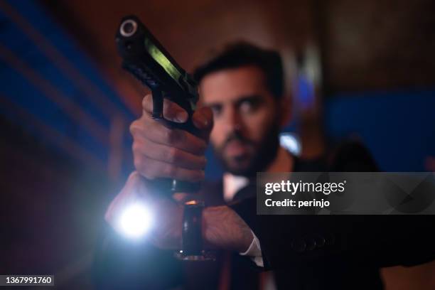 fbi agent pointing the gun with the flashlight above - ambush stock pictures, royalty-free photos & images