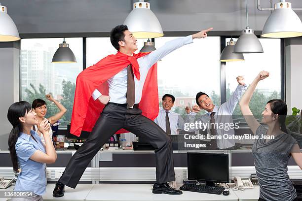 colleagues cheering on superhero - chinese hero bildbanksfoton och bilder