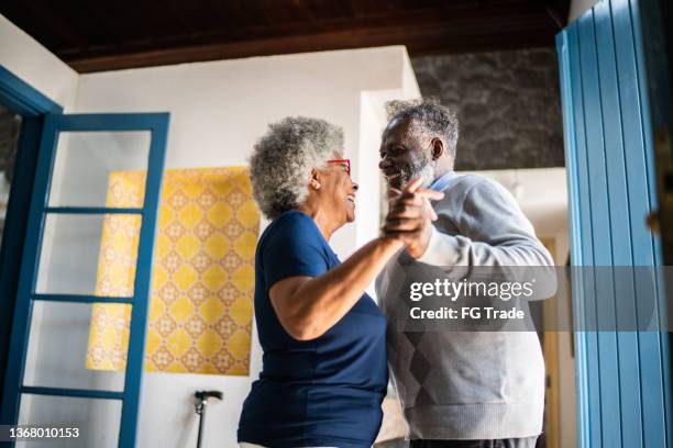 senior couple dancing at home - free pictures ballroom dancing stock pictures, royalty-free photos & images