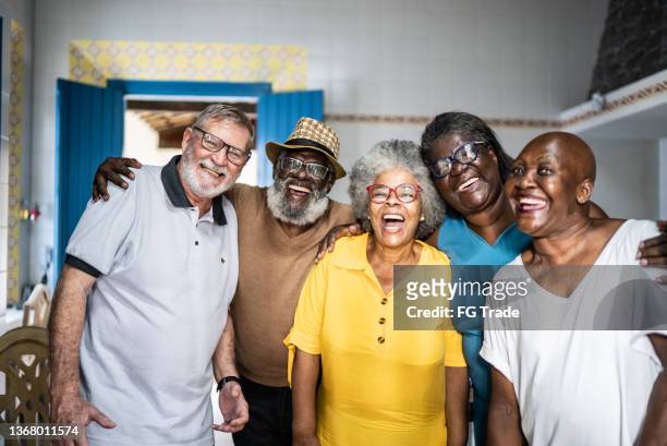 portrait of friends together at home - senior men group stock pictures, royalty-free photos & images